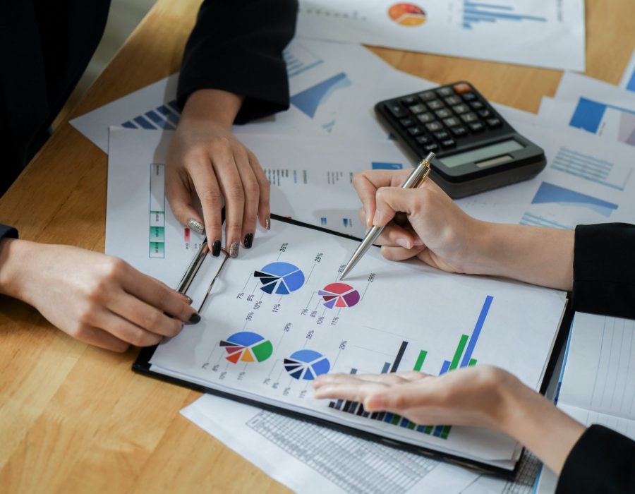 Female accountant team is analyzing data to present the client.